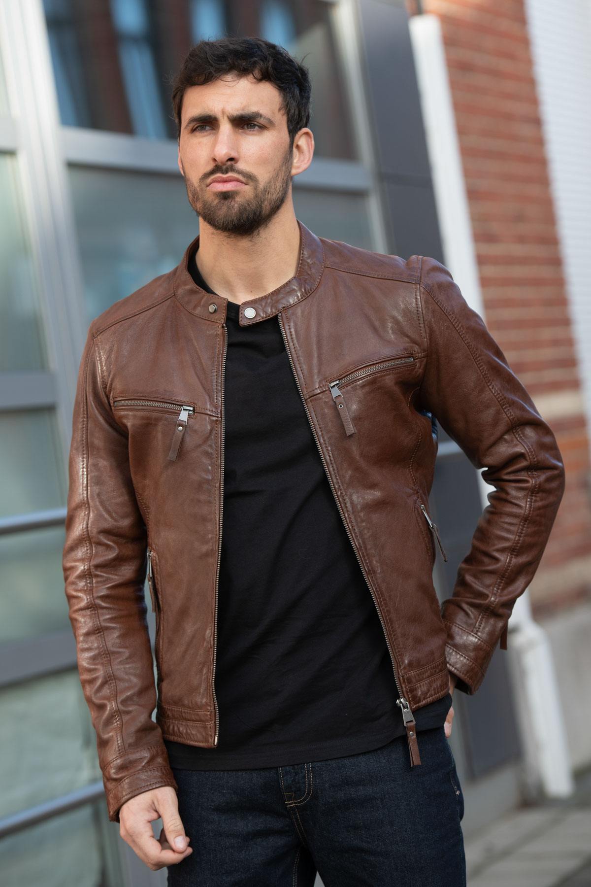 Mid-brown leather jacket with a motard collar and a snug, aged fit. - Image n°1