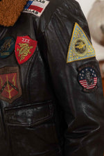 Slim maroon goatskin bomber with 17 patches and a detachable collar. - Image n°11