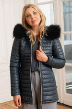A tailored lambskin coat in petrol blue, quilted for warmth and style. - Image n°6