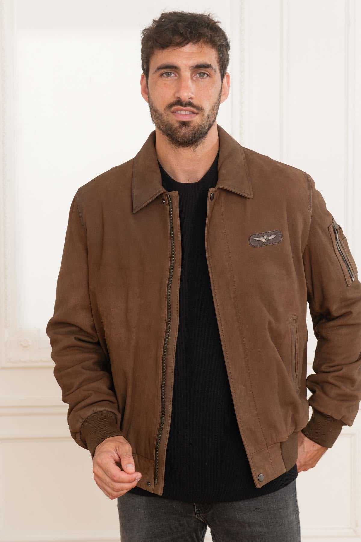 A suede sheepskin bomber in chocolate, cut for year-round versatility. - Image n°1