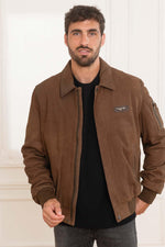 A suede sheepskin bomber in chocolate, cut for year-round versatility. - Image n°1