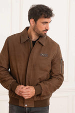 A suede sheepskin bomber in chocolate, cut for year-round versatility. - Image n°4