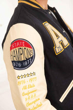 AC-17 varsity jacket: navy and beige wool with sheepskin sleeves. - Image n°6