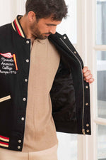 Black wool and beige leather varsity jacket for a sporty look. - Image n°5