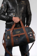 Navy blue leather travel bag with patches - Image n°1