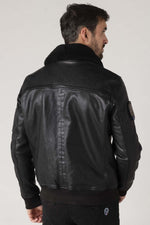 Black sheepskin aviator jacket with fur collar for warmth and style. - Image n°8