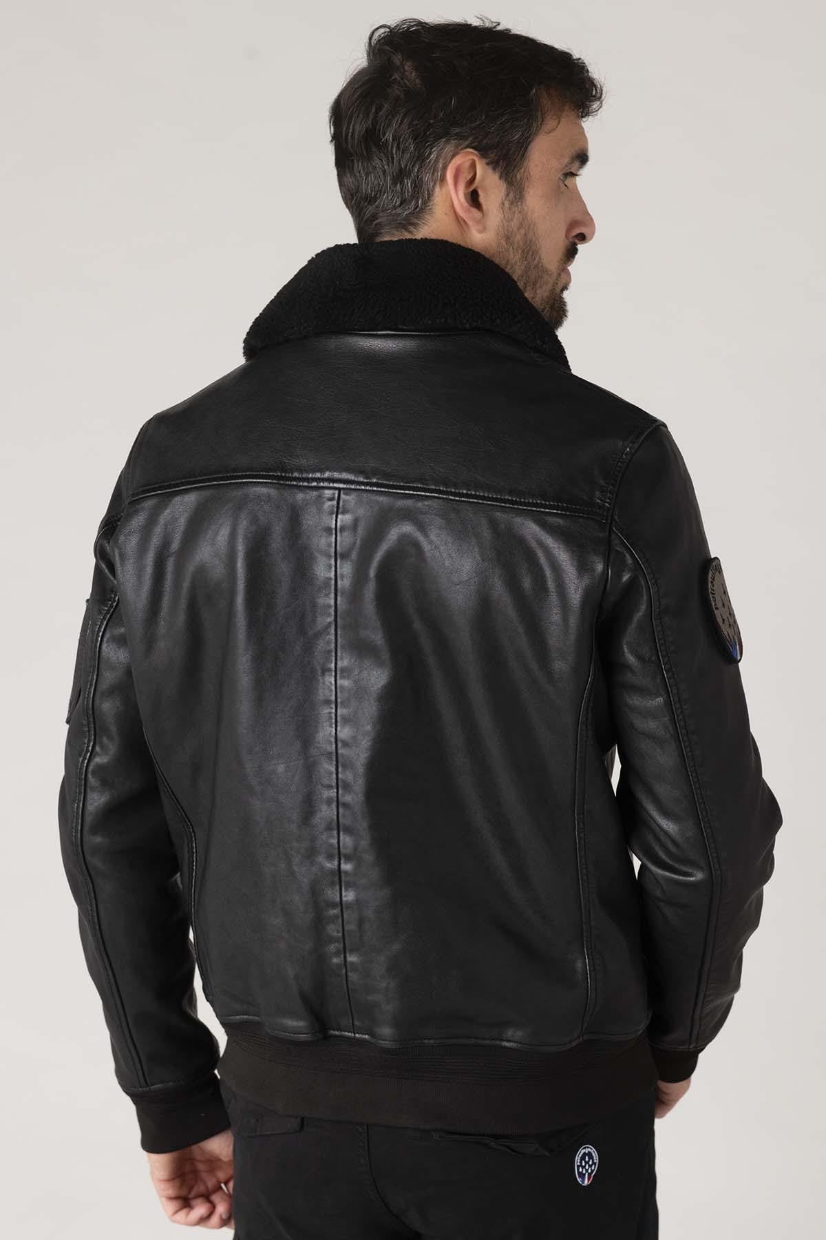 Black sheepskin aviator jacket with fur collar for warmth and style. - Image n°8