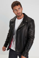 Sleek black cowhide biker jacket with zip sleeves and rivets. - Image n°4