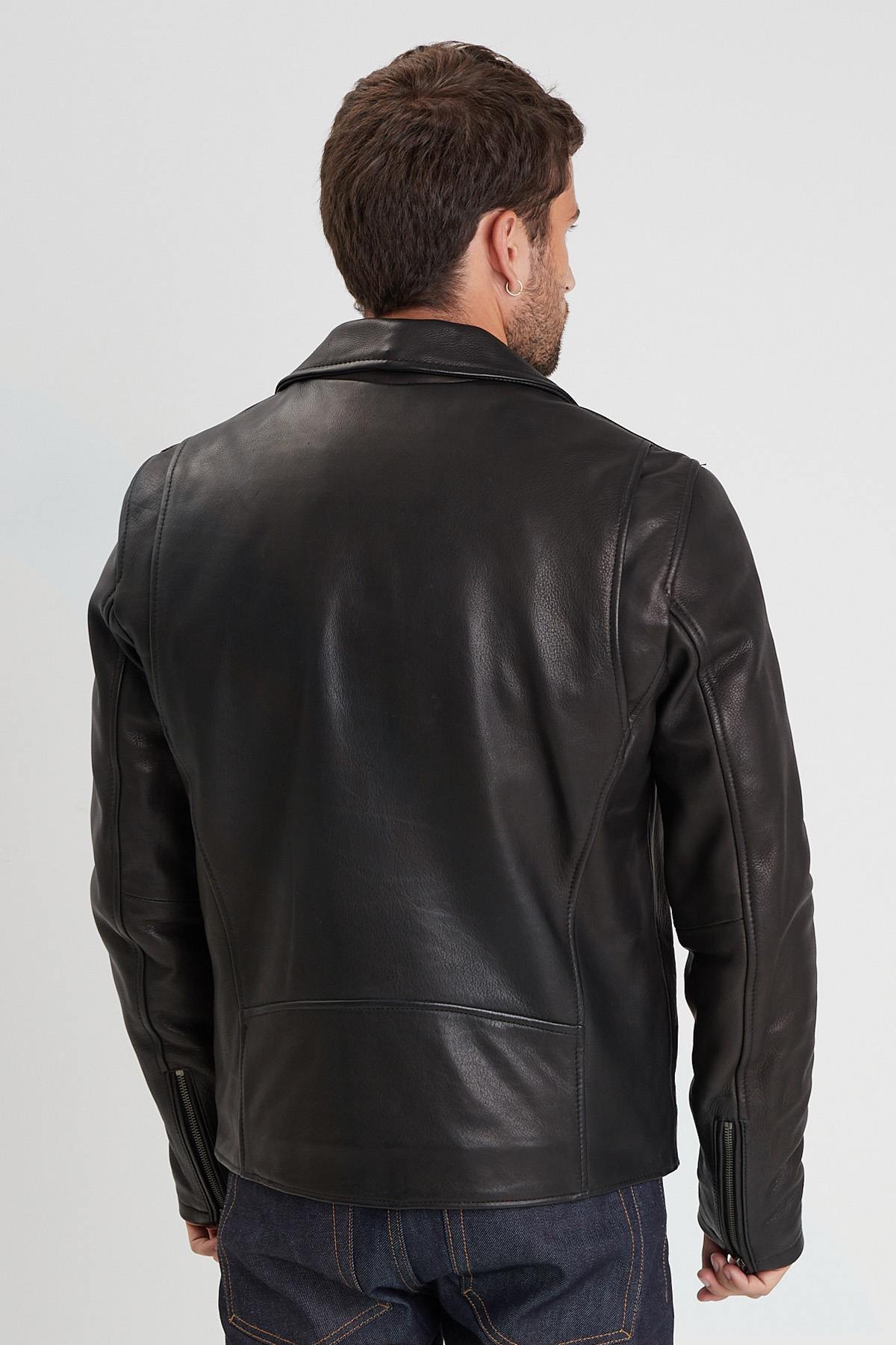 Sleek black cowhide biker jacket with zip sleeves and rivets. - Image n°7
