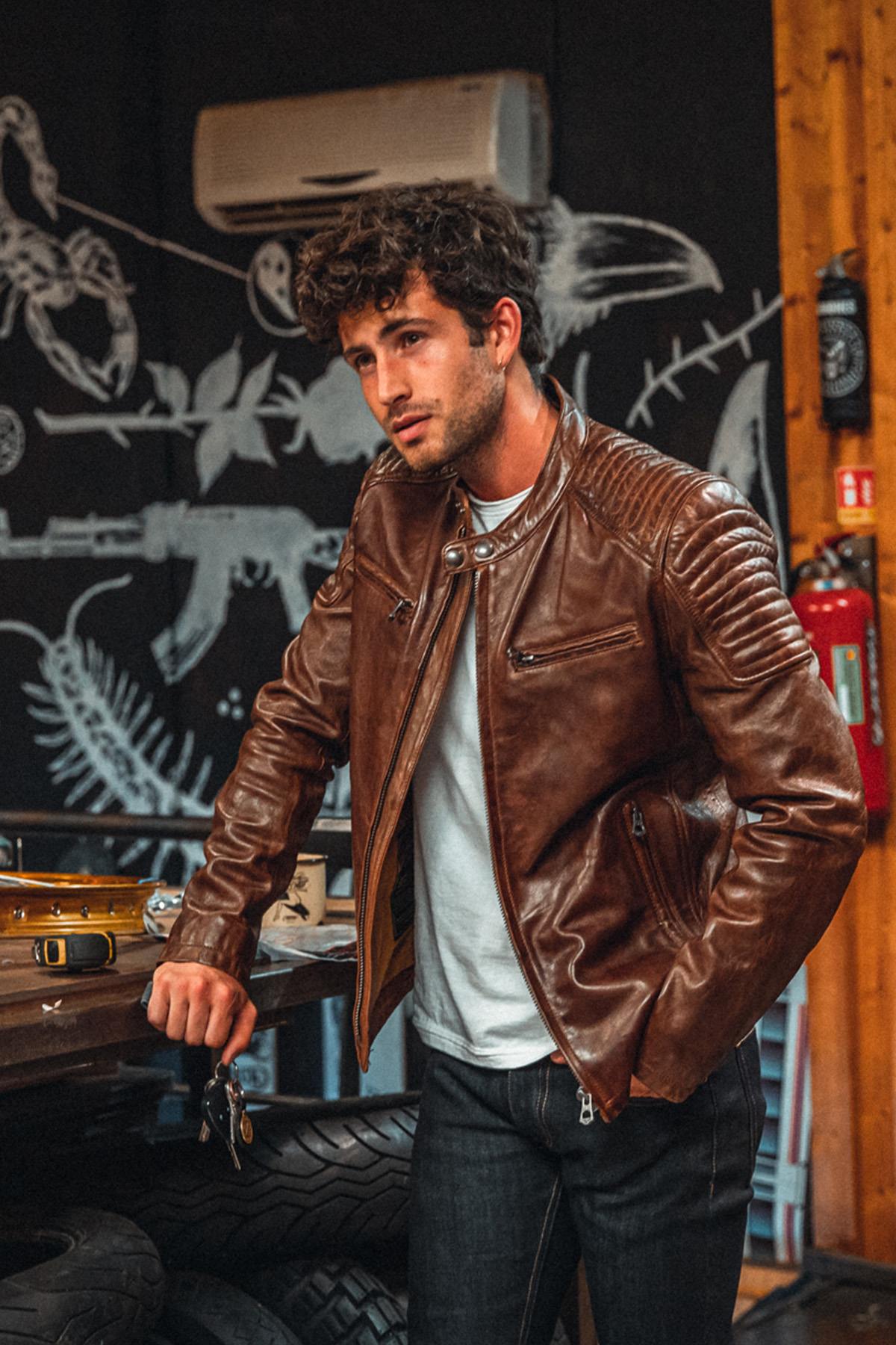 Oiled dark cognac lambskin in a vintage biker cut. Slim, quilted shoulders. - Image n°1