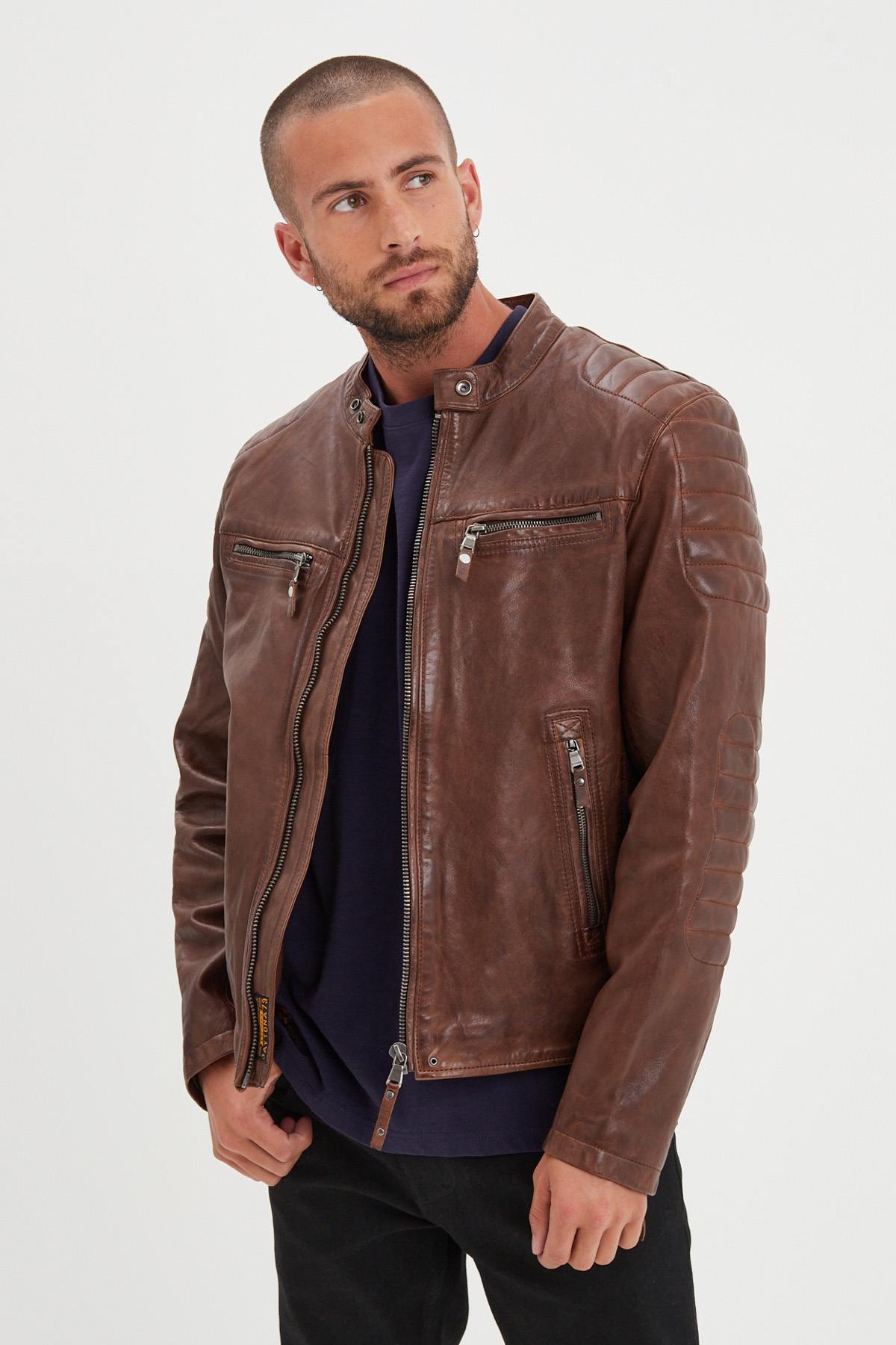 Dark cognac lambskin biker jacket with quilted shoulders and straps. - Image n°1