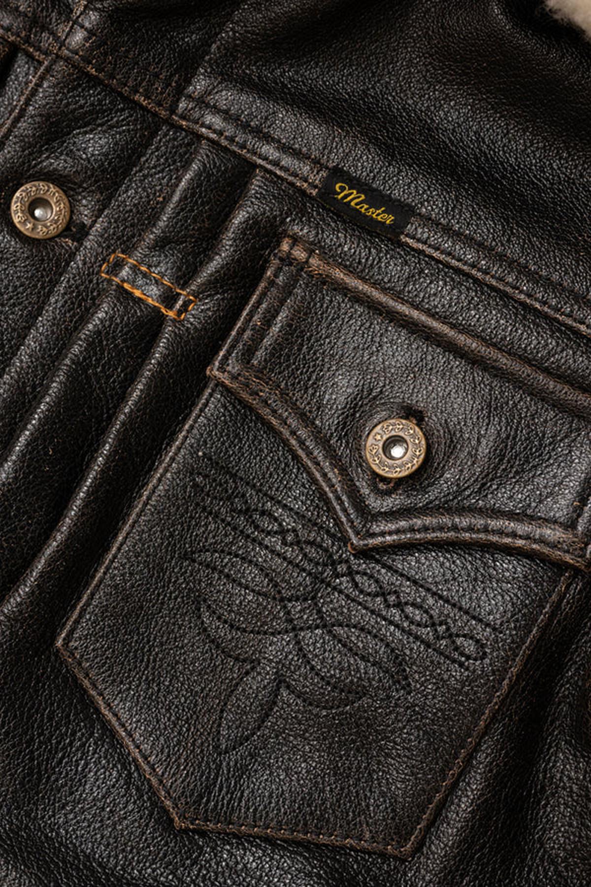 Buffalo leather trucker jacket with rapid patina for vintage charm. - Image n°8