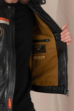 Black lambskin biker jacket with orange accents, sleek and sporty. - Image n°6