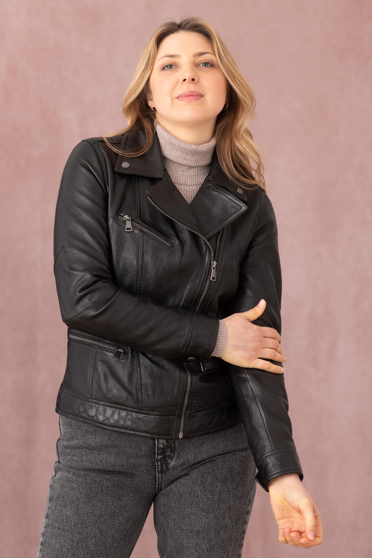 Black lambskin biker jacket with metallic rivets and a rock-chic edge. - Image n°1
