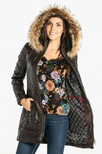 Sleek lambskin jacket with detachable fur-trimmed hood for winter. - Image n°1