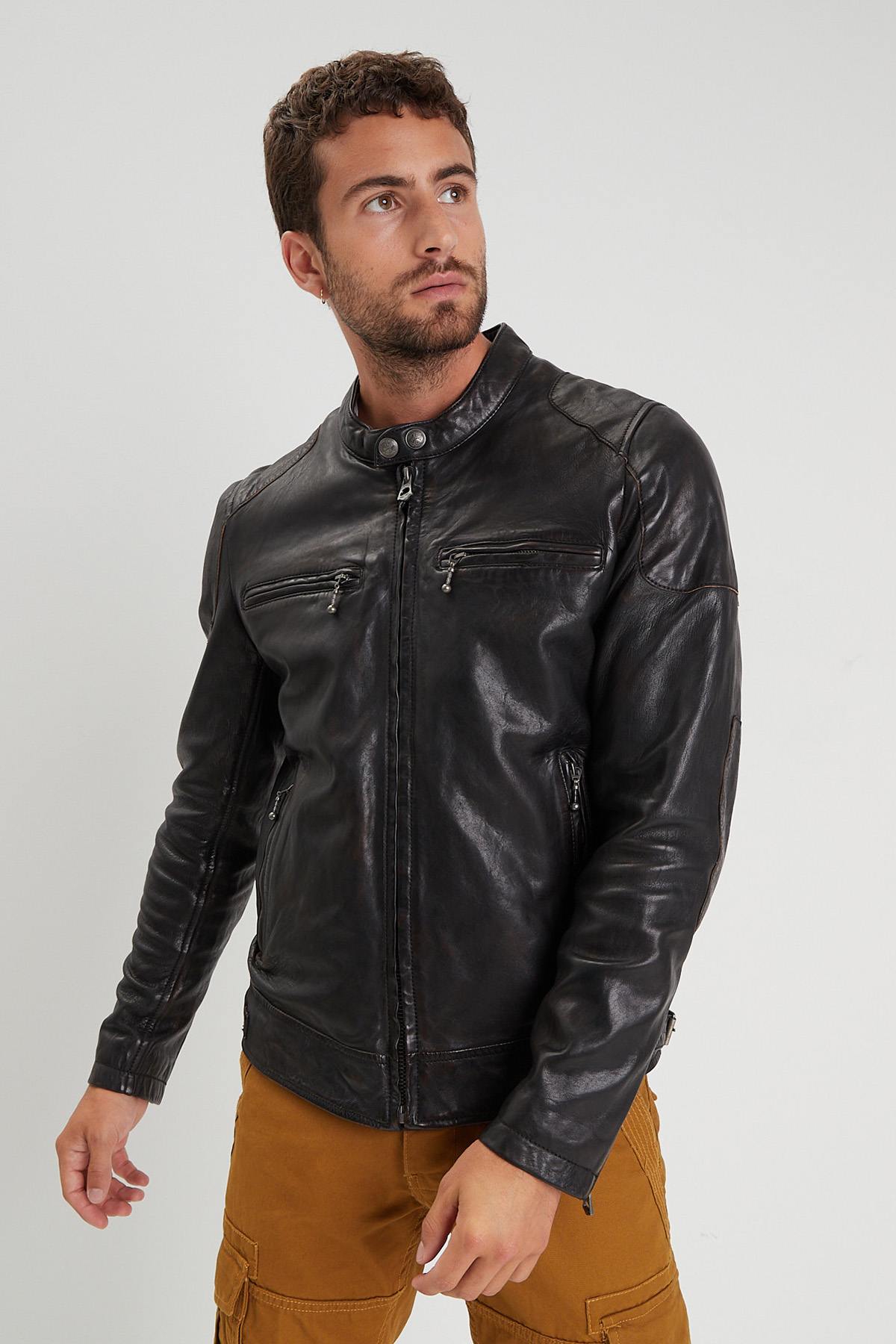 Aged lambskin biker jacket with metal grommets and zippered cuffs. - Image n°1