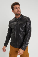 Aged lambskin biker jacket with metal grommets and zippered cuffs. - Image n°1