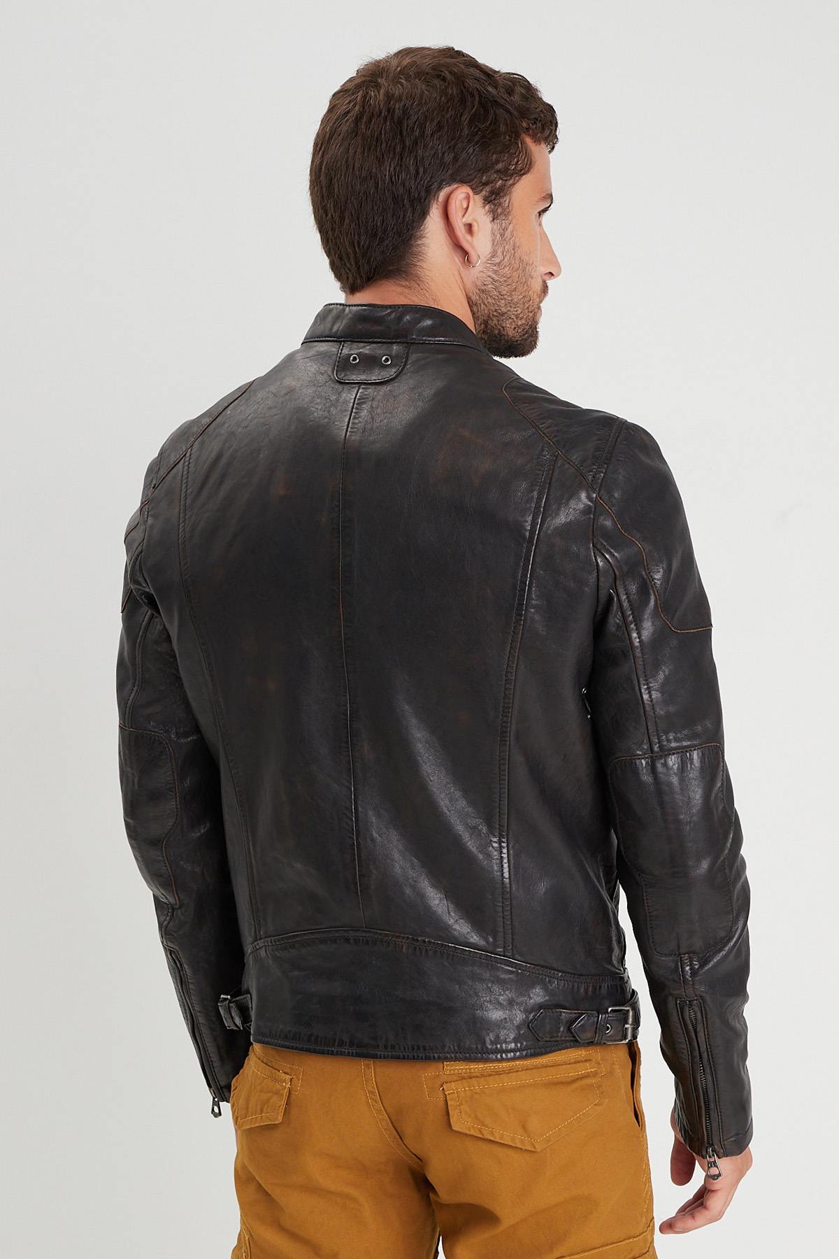 Aged lambskin biker jacket with metal grommets and zippered cuffs. - Image n°2