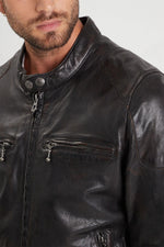 Aged lambskin biker jacket with metal grommets and zippered cuffs. - Image n°3