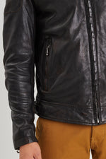 Aged lambskin biker jacket with metal grommets and zippered cuffs. - Image n°5
