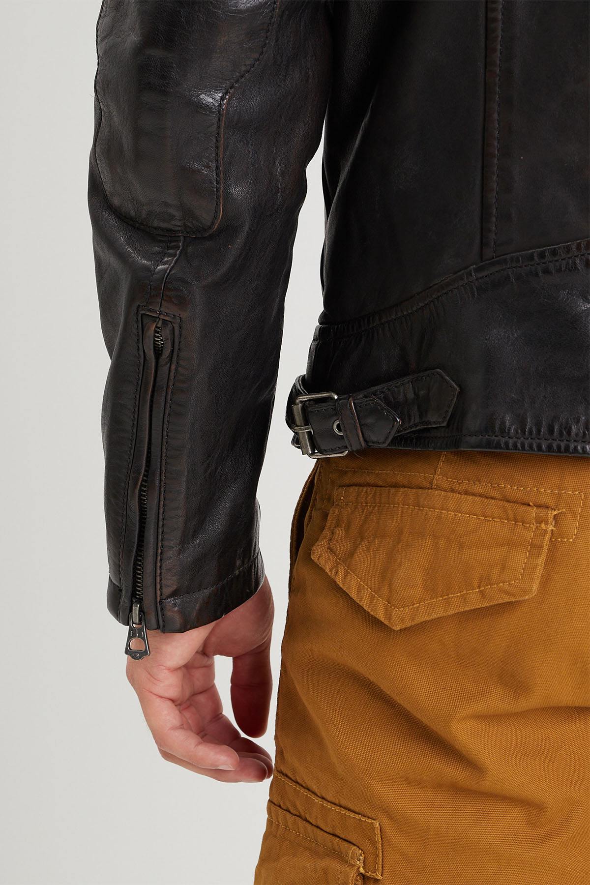 Aged lambskin biker jacket with metal grommets and zippered cuffs. - Image n°6
