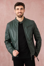 A forest-green lambskin biker jacket by Redskins with snap collar. - Image n°1