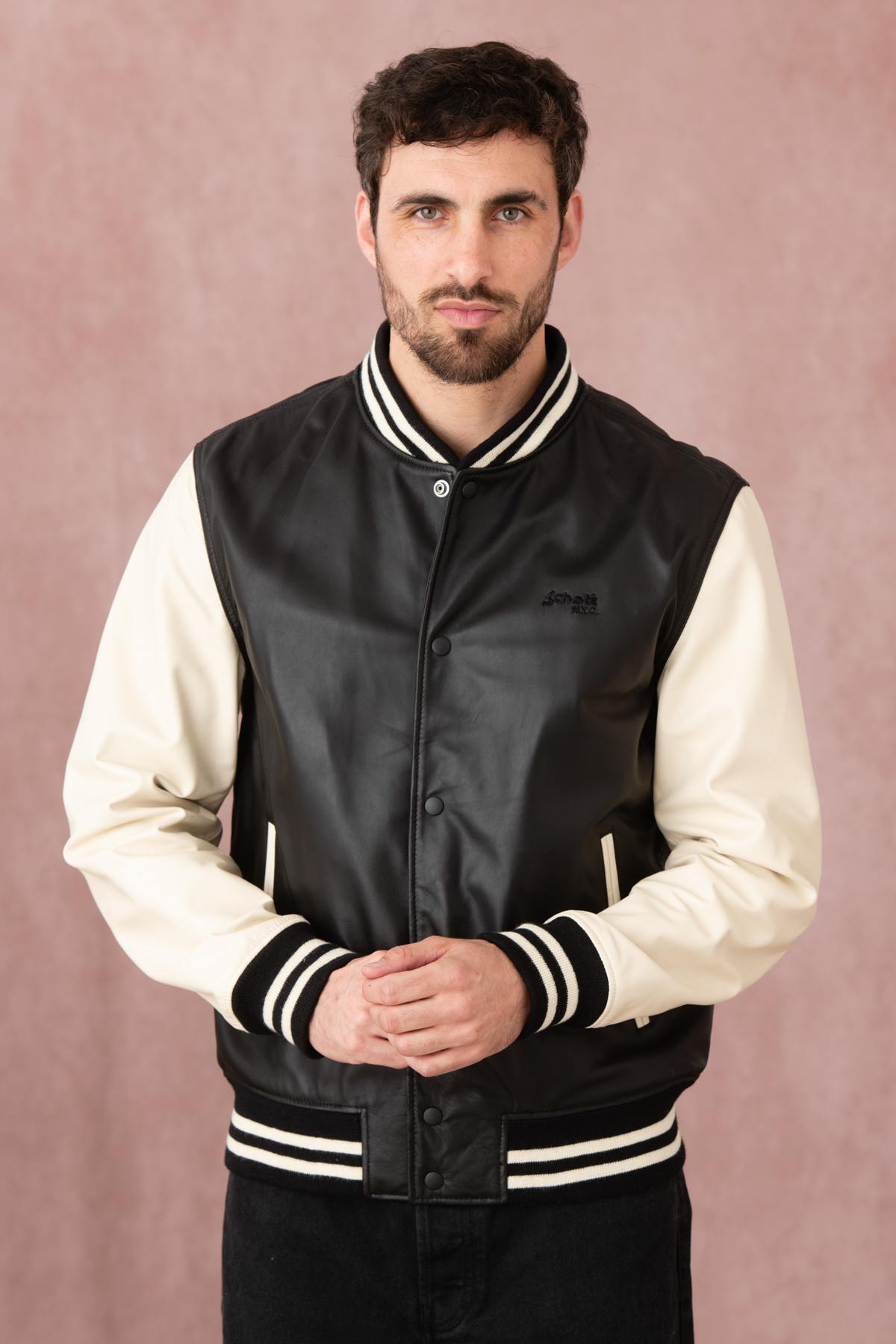 Schott's varsity-style lambskin jacket in black and off-white. - Image n°6