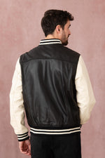 Schott's varsity-style lambskin jacket in black and off-white. - Image n°5