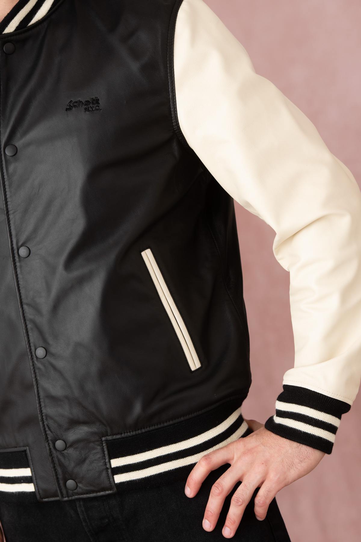 Schott's varsity-style lambskin jacket in black and off-white. - Image n°8