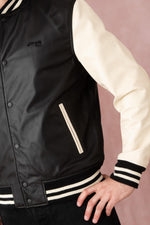 Schott's varsity-style lambskin jacket in black and off-white. - Image n°8