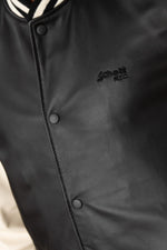 Schott's varsity-style lambskin jacket in black and off-white. - Image n°7