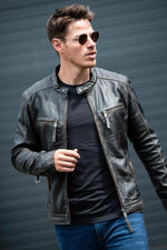Aged-black sheep leather jacket. Slim fit, zipped pockets and cuffs. - Image n°1