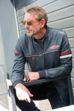A sleek royal blue sheepskin jacket with sporty contrast stitching. - Image n°1