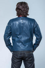 Steve McQueen's 1970s racing legacy in a royal blue sheepskin jacket. - Image n°7