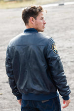 Limited-edition navy sheepskin jacket inspired by Apollo 13's legacy. - Image n°11