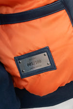 Limited-edition navy sheepskin jacket inspired by Apollo 13's legacy. - Image n°7