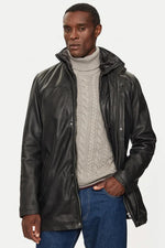 Black lambskin parka with detachable vegan-fur hood for urban warmth. - Image n°1
