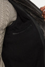 Black lambskin parka with detachable vegan-fur hood for urban warmth. - Image n°6