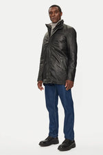 Black lambskin parka with detachable vegan-fur hood for urban warmth. - Image n°2