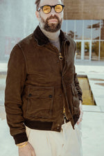 Aged whisky goatskin suede, burnt for a dark, lustrous finish. Tri-season versatility with removable lining. - Image n°1
