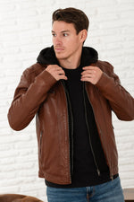 A maroon sheepskin leather jacket with zip front and removable hood. - Image n°1