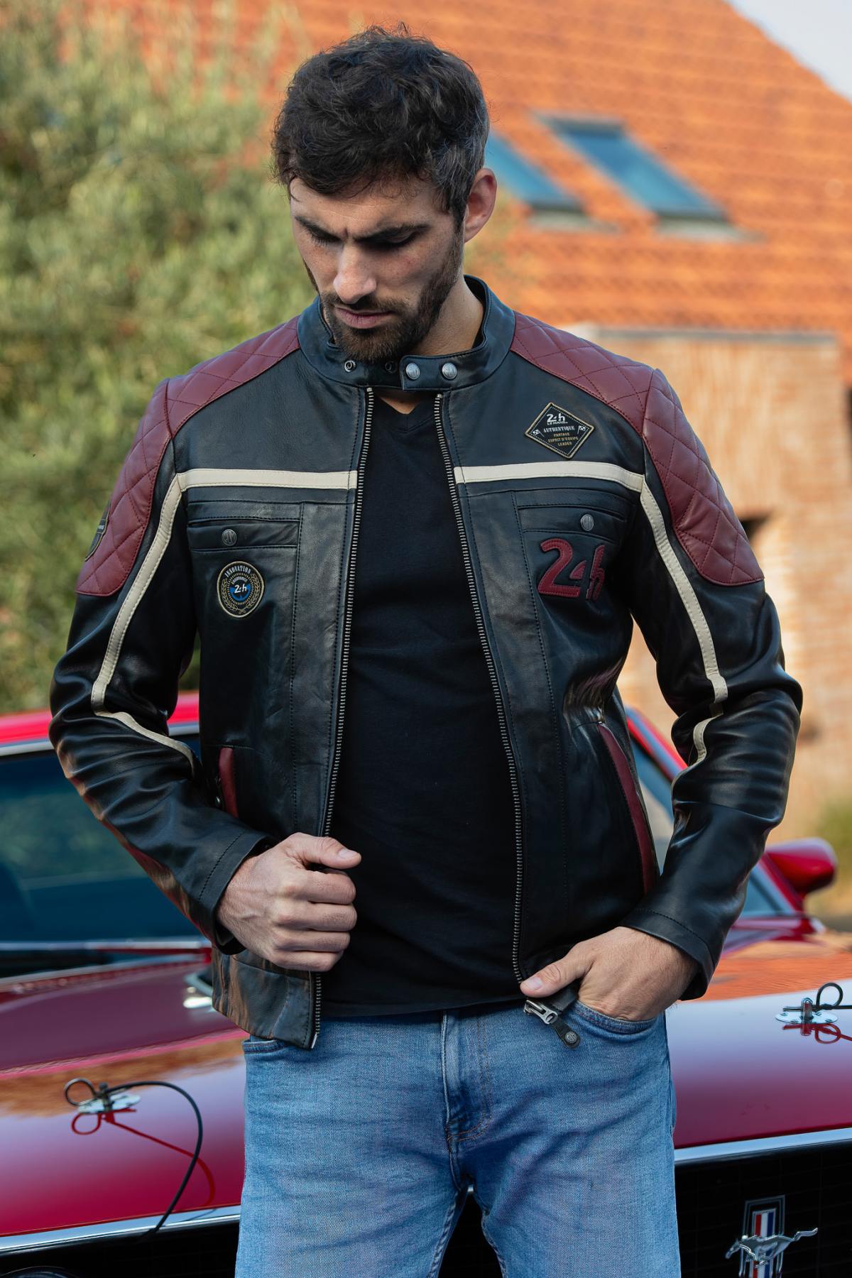 Le Mans-inspired black sheep leather jacket with vintage badges. - Image n°1