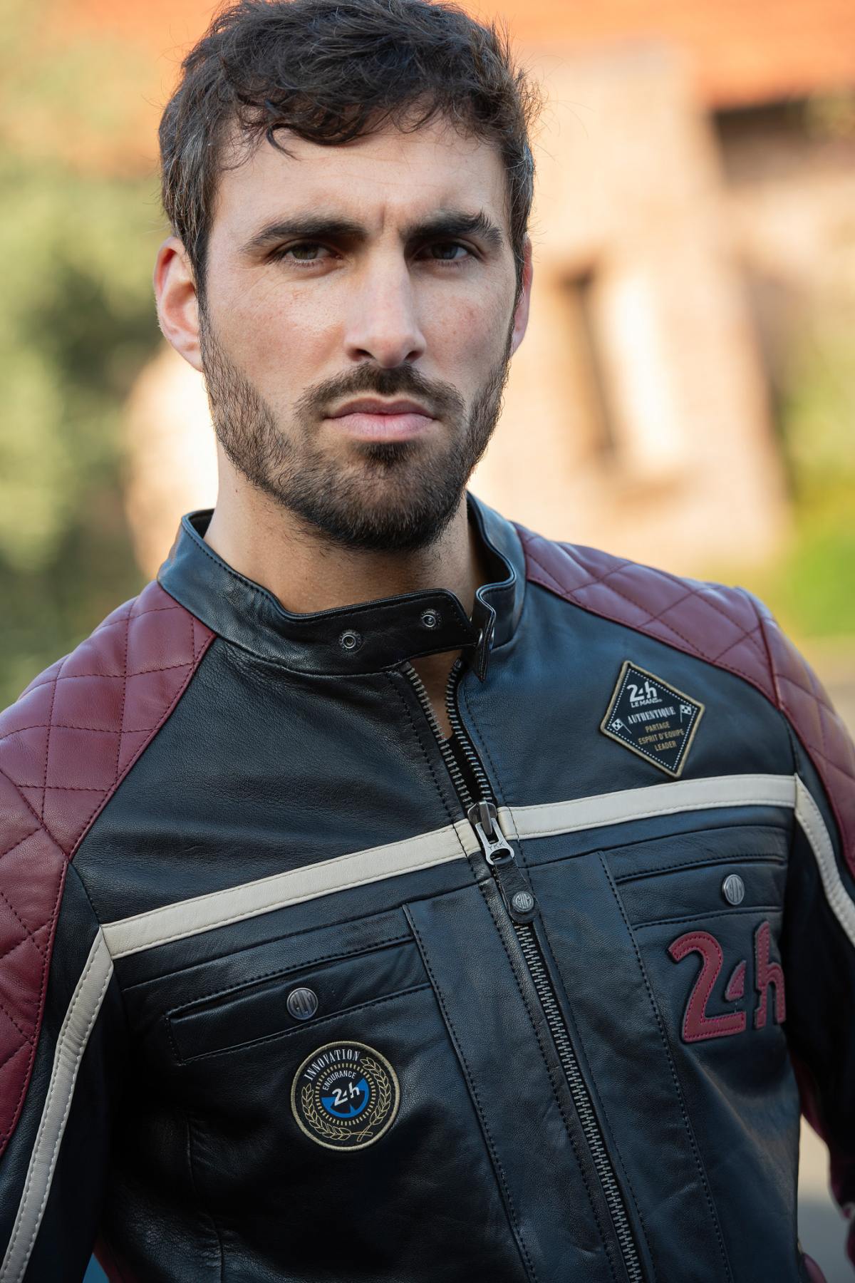 Le Mans-inspired black sheep leather jacket with vintage badges. - Image n°6