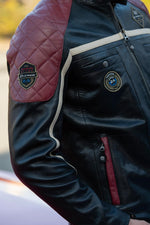 Le Mans-inspired black sheep leather jacket with vintage badges. - Image n°2