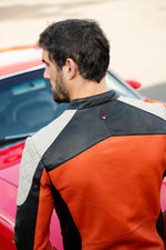 Rider's orange sheepskin jacket. Le Mans heritage, bold biker style. - Image n°6