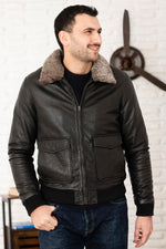 Black leather bomber jacket with fur collar - Image n°1
