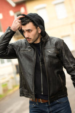 Black sheepskin jacket with a rub-off finish and removable hood. - Image n°1