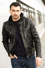 Slimfit lambskin jacket in glossy black. Moto collar, detachable hood. - Image n°1