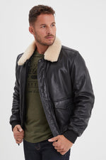Black leather bomber jacket with sheepskin fur collar - Image n°1