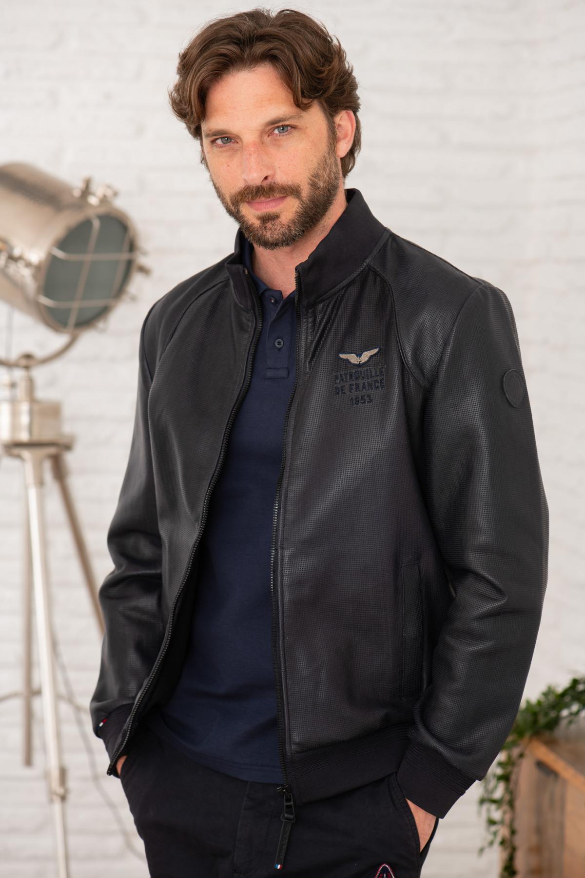 Perforated lambskin jacket in navy, stand-up collar, snap pockets. - Image n°1